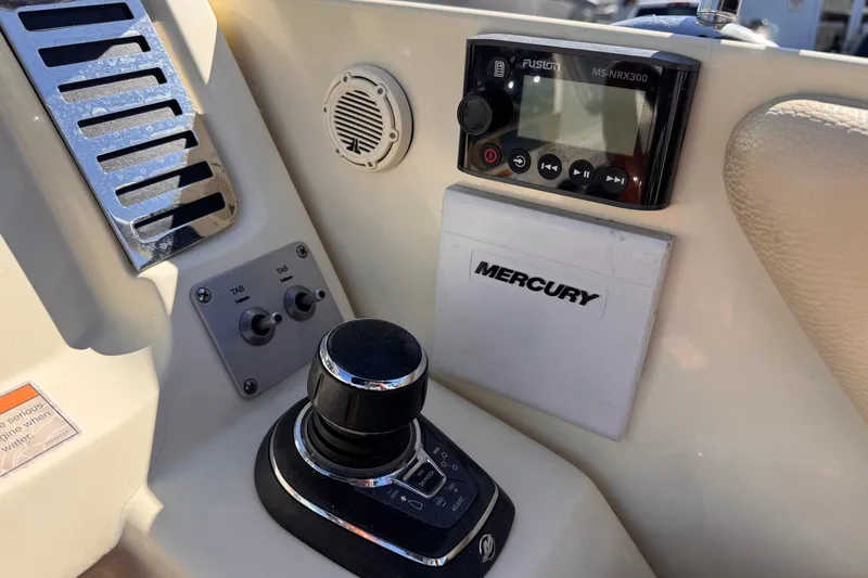 Slide: The Image of Control panel of 2019 Chris-Craft Corsair 30 boat with Mercury and Fusion systems. - 22