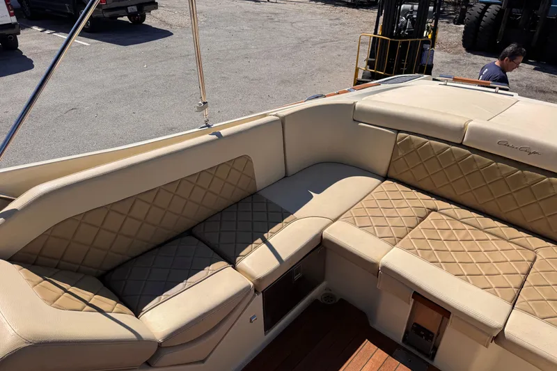 Slide: The Image of 2019 Chris-Craft Corsair 30 boat interior with beige quilted seating. - 9