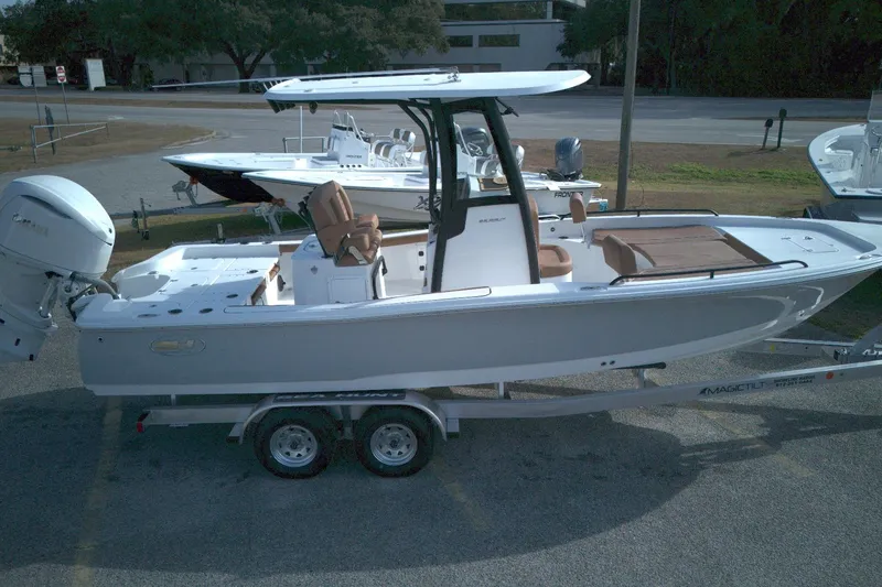 Slide: The Image of 2026 Sea Hunt BX 25 FS boat on trailer, parked outdoors. - 5