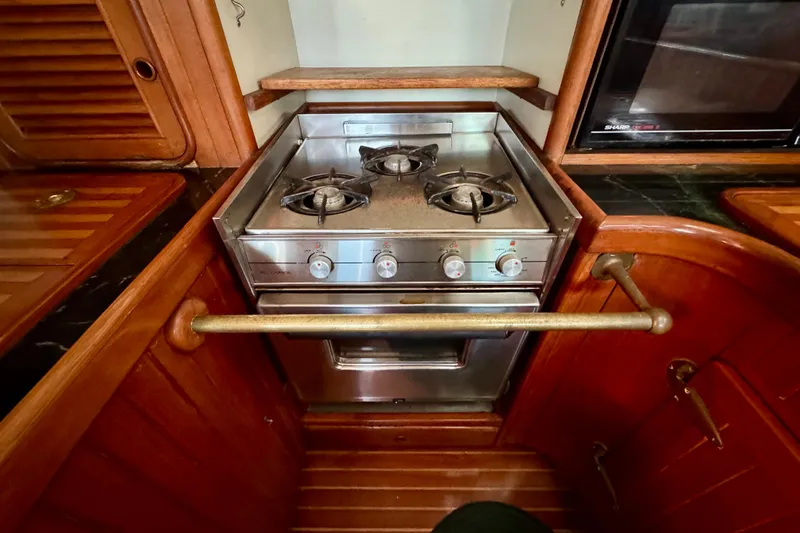 Slide: The Image of Compact kitchen stove in a 1988 Hans Christian Christina yacht, featuring three burners. - 10