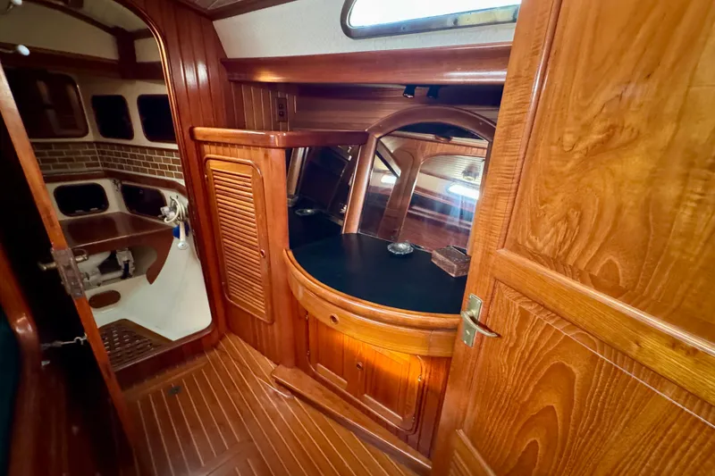 Slide: The Image of 1988 Hans Christian Christina yacht interior with wooden cabinetry and nautical design. - 21