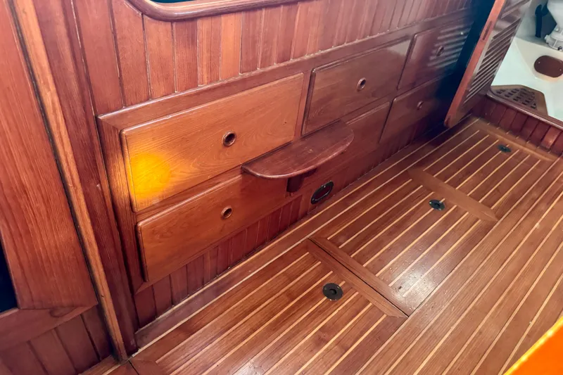 Slide: The Image of Interior of 1988 Hans Christian Christina boat with wooden cabinetry and flooring. - 25
