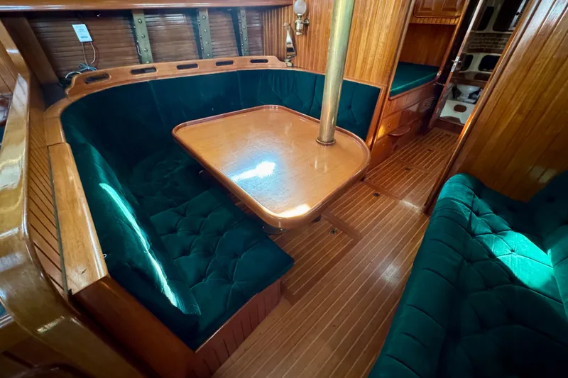 Slide: The Image of Luxurious 1988 Hans Christian Christina yacht interior with elegant wood and plush seating. - 7