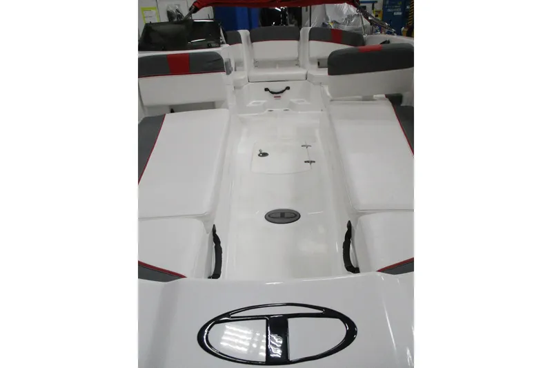 Slide: The Image of 2025 Tahoe T18 boat interior with white and gray seating, red accents. - 2