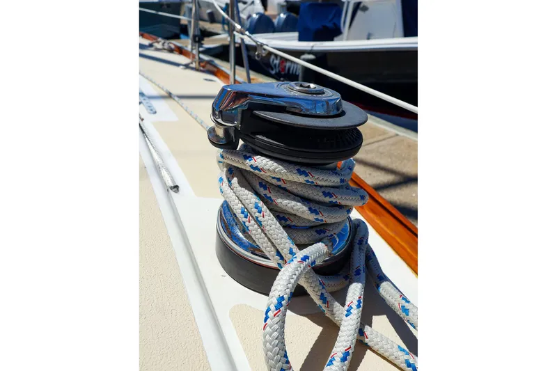 Slide: The Image of Sailboat winch with coiled rope on a 1999 Tartan 3500 yacht deck. - 14