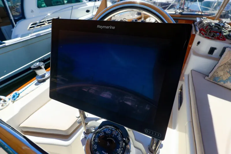 Slide: The Image of Cockpit of 1999 Tartan 3500 sailboat with Raymarine navigation display. - 15