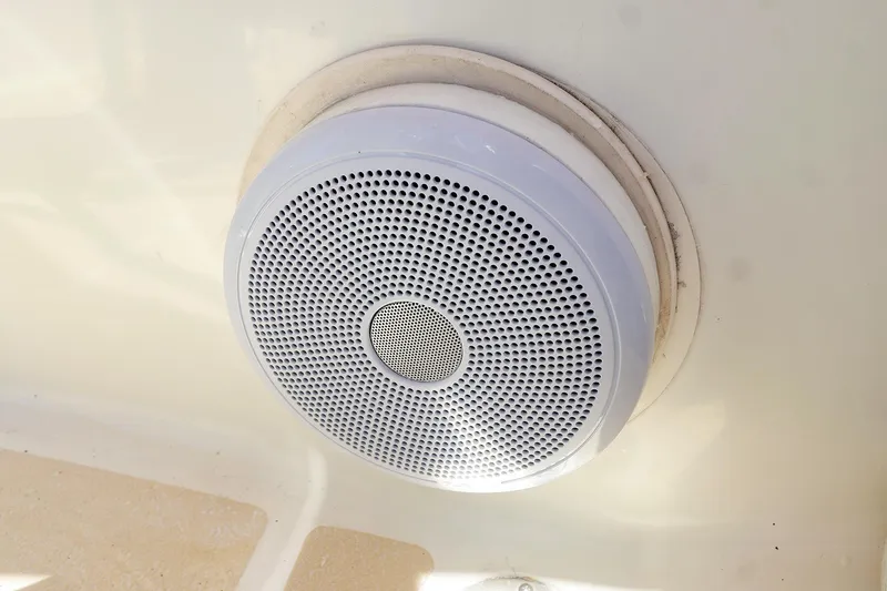 Slide: The Image of White speaker installed on a 1999 Tartan 3500 boat interior. - 19