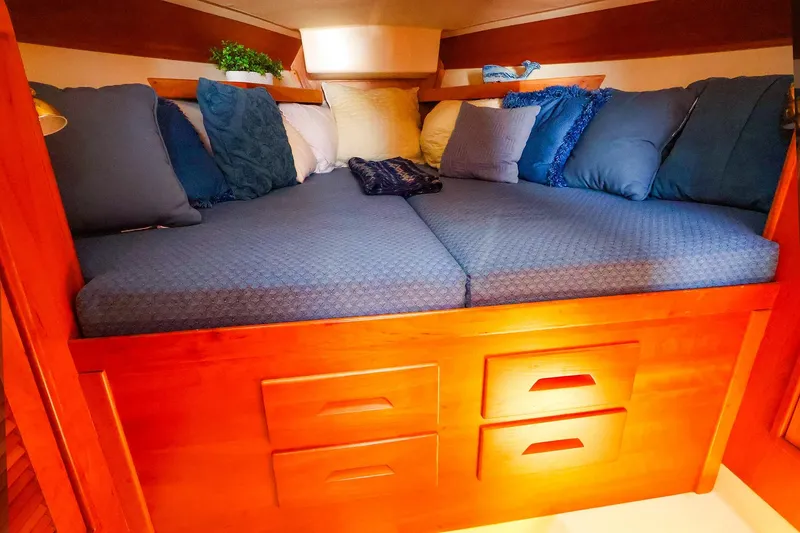 Slide: The Image of Cozy cabin bed with blue cushions in 1999 Tartan 3500 sailboat. - 28