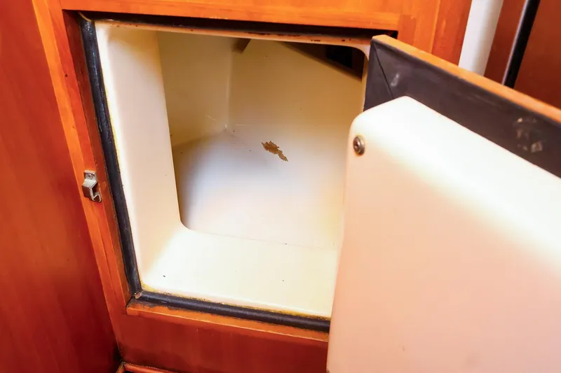Slide: The Image of Open storage compartment in a 1999 Tartan 3500 boat interior. - 37