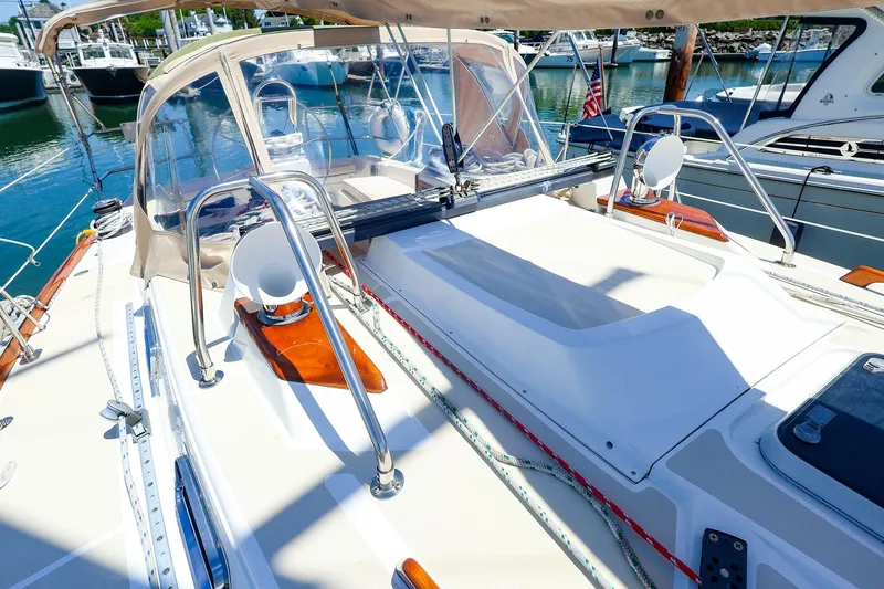 Slide: The Image of Sailboat deck view of a 1999 Tartan 3500 in a marina setting. - 9