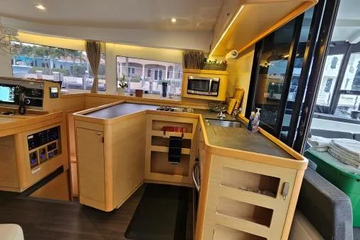 Slide: The Image of Interior of 2017 Lagoon 42 catamaran with modern kitchen and sleek design. - 12