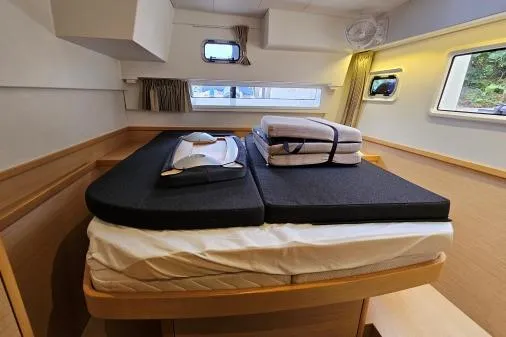 Slide: The Image of Cozy cabin interior of 2017 Lagoon 42 catamaran with neatly arranged bedding. - 18