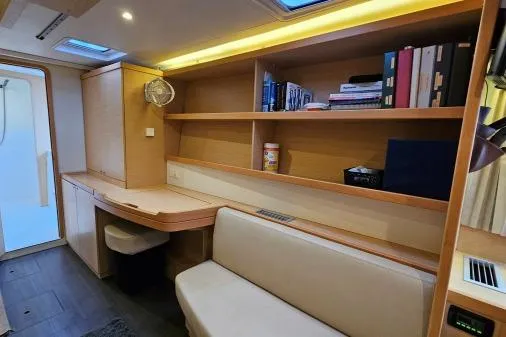 Slide: The Image of Interior of 2017 Lagoon 42 yacht with wooden shelves and seating area. - 20