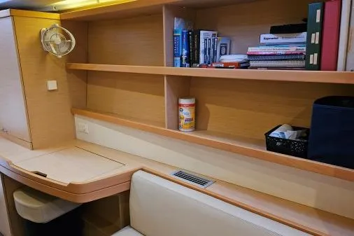 Slide: The Image of Interior of 2017 Lagoon 42 yacht with wooden shelves and seating area. - 21