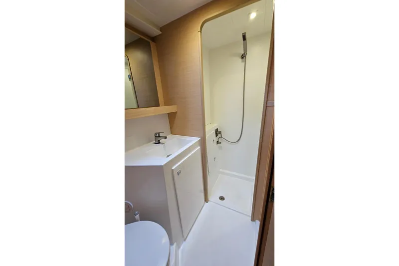 Slide: The Image of 2017 Lagoon 42 yacht bathroom with shower, sink, and modern fixtures. - 24