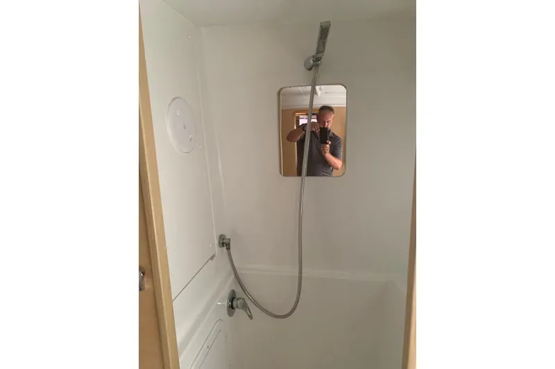 Slide: The Image of Shower area in 2017 Lagoon 42 yacht with mirror and handheld showerhead. - 27
