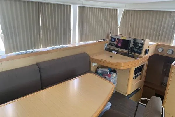 Slide: The Image of Interior of 2017 Lagoon 42 yacht with navigation station and seating area. - 28