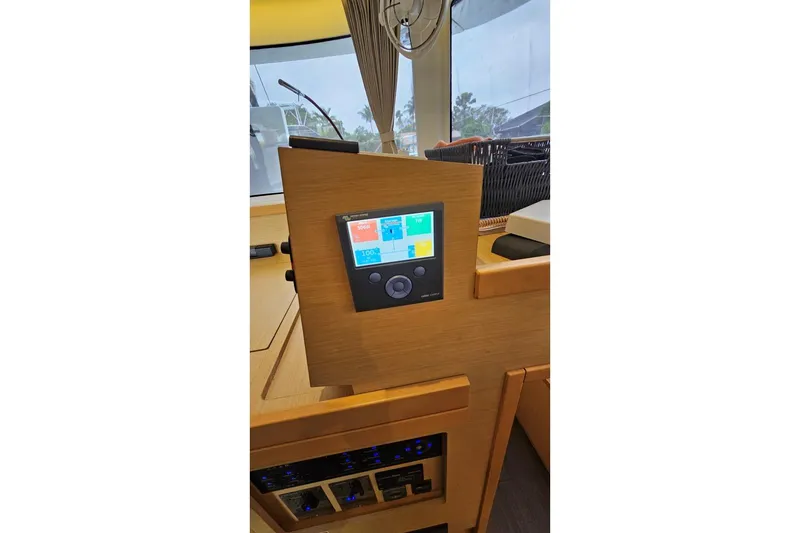 Slide: The Image of Control panel inside 2017 Lagoon 42 catamaran, featuring modern navigation and monitoring systems. - 30