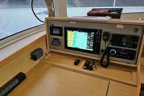 Slide: The Image of Navigation station of 2017 Lagoon 42 catamaran with electronic controls and display. - 32