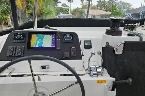 Slide: The Image of Cockpit of 2017 Lagoon 42 catamaran with navigation equipment and steering wheel. - 34
