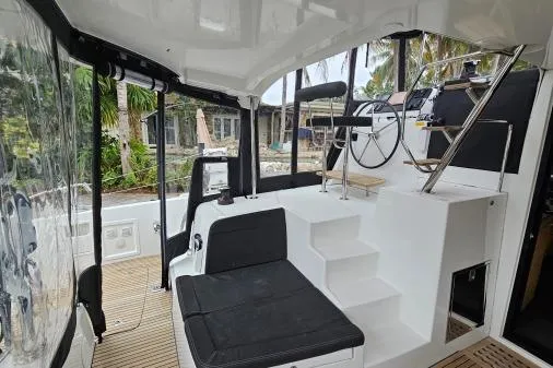 Slide: The Image of Interior view of 2017 Lagoon 42 catamaran cockpit with seating and steering wheel. - 41