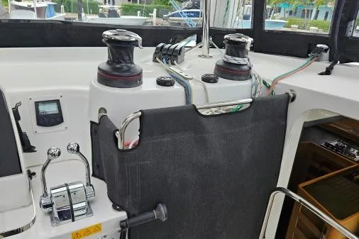 Slide: The Image of 2017 Lagoon 42 yacht cockpit with winches and control panel. - 44