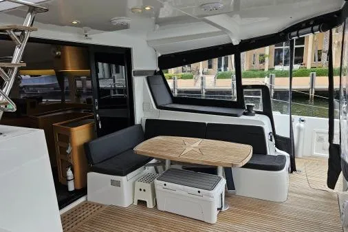 Slide: The Image of 2017 Lagoon 42 yacht interior with seating, table, and modern design. - 47