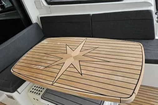 Slide: The Image of Teak table with star design on 2017 Lagoon 42 yacht interior. - 49