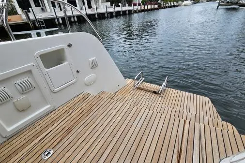 Slide: The Image of Teak deck of 2017 Lagoon 42 catamaran by the water. - 50