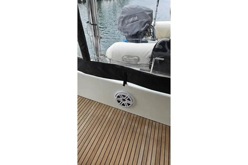 Slide: The Image of 2017 Lagoon 42 yacht deck with Yamaha engine cover and marine speaker. - 52