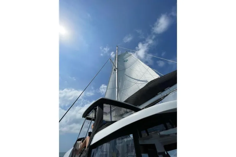 Slide: The Image of Sailing on a 2017 Lagoon 42 catamaran under clear blue skies. - 64