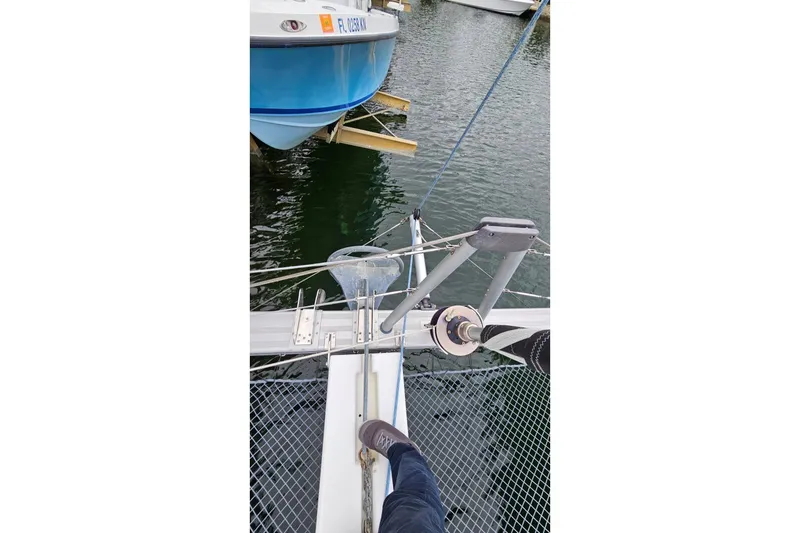 Slide: The Image of 2017 Lagoon 42 catamaran bow with netting and mooring lines in marina. - 69