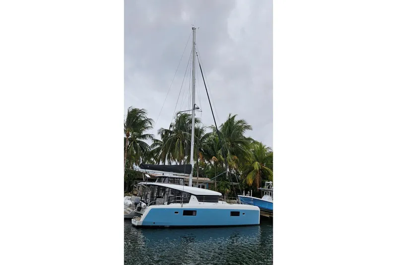Slide: The Image of 2017 Lagoon 42 catamaran sailing on calm waters under clear blue sky. - 82