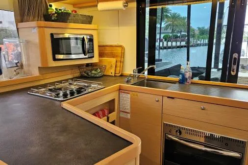 Slide: The Image of Modern kitchen interior of 2017 Lagoon 42 catamaran with appliances and waterfront view. - 9