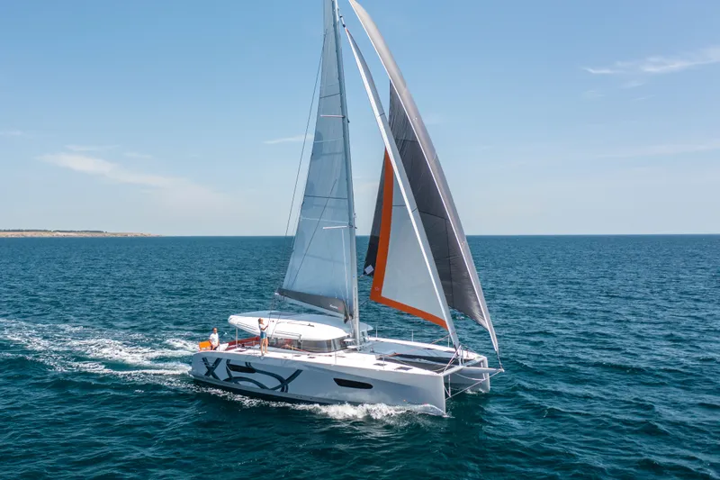 Slide: The Image of 2026 Excess 14 catamaran sailing on open sea. - 3