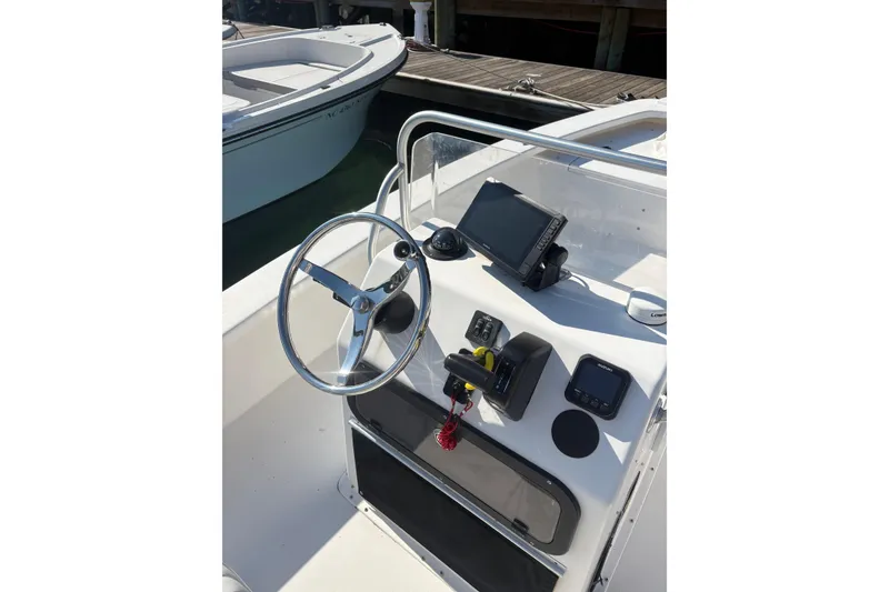 Slide: The Image of 2007 Intruder 198 boat dashboard with steering wheel and navigation equipment. - 4