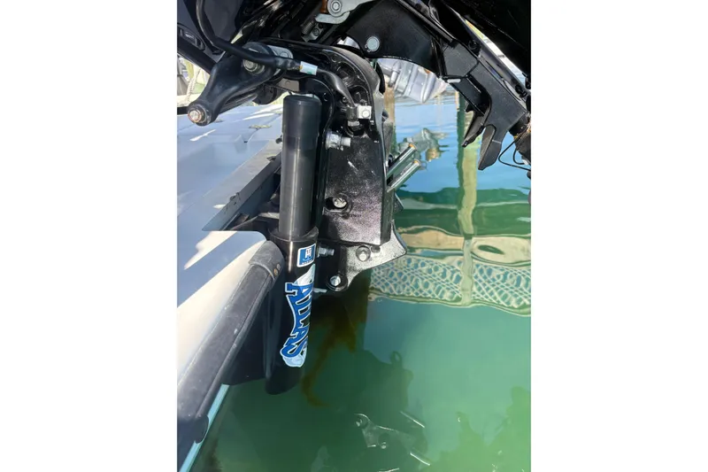 Slide: The Image of Close-up of a 2007 Intruder 198 boat motor part above water. - 8