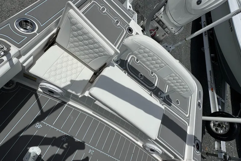 Slide: The Image of 2024 Contender 26 Bay boat interior with cushioned seating and sleek design. - 23