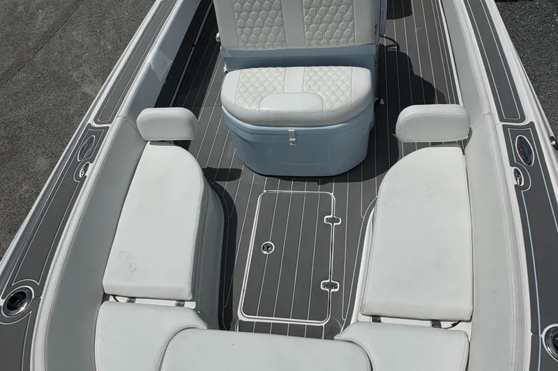 Slide: The Image of 2024 Contender 26 Bay boat interior with cushioned seating and sleek design. - 26