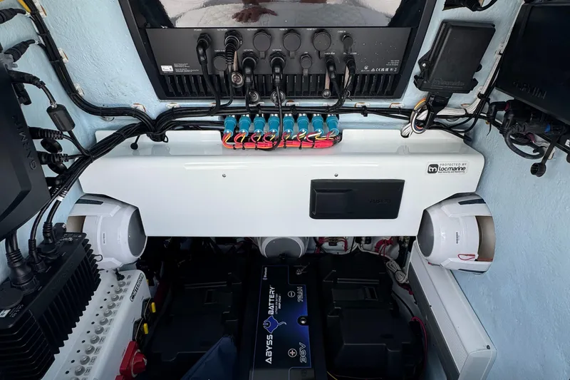 Slide: The Image of 2024 Contender 26 Bay boat electronics and battery setup, showcasing advanced marine technology. - 27