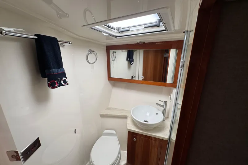 Slide: The Image of Luxurious bathroom in 2016 Riviera 43 Open Flybridge yacht with modern fixtures. - 15