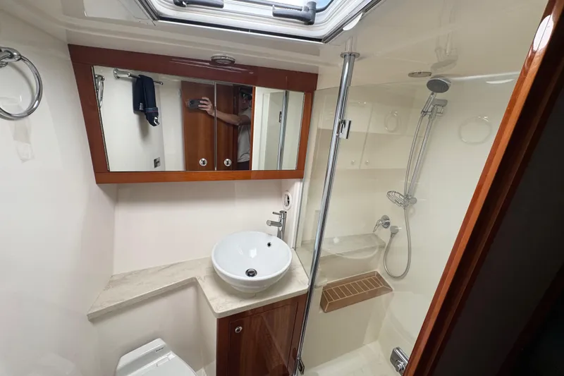 Slide: The Image of Luxurious bathroom in 2016 Riviera 43 Open Flybridge yacht with modern fixtures and shower. - 16