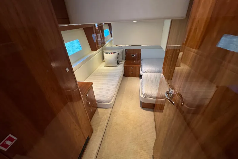 Slide: The Image of Luxurious cabin interior of 2016 Riviera 43 Open Flybridge yacht with twin beds. - 18
