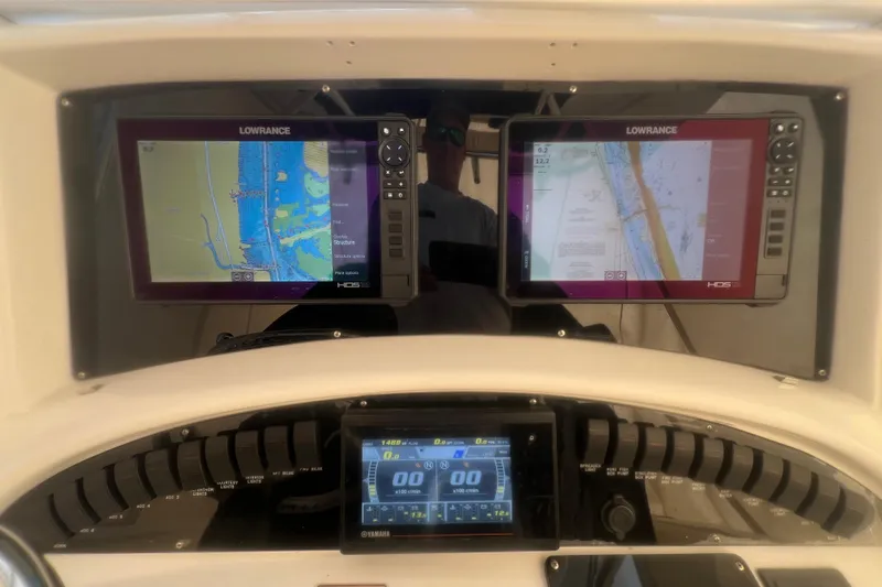 Slide: The Image of Dashboard of a 2005 Boston Whaler 320 Outrage with dual Lowrance navigation screens. - 11