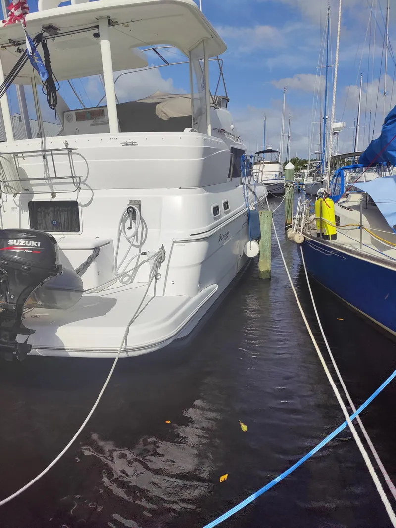 Slide: The Image of 2001 Cruisers Yachts 3750 Motoryacht docked at marina. - 2