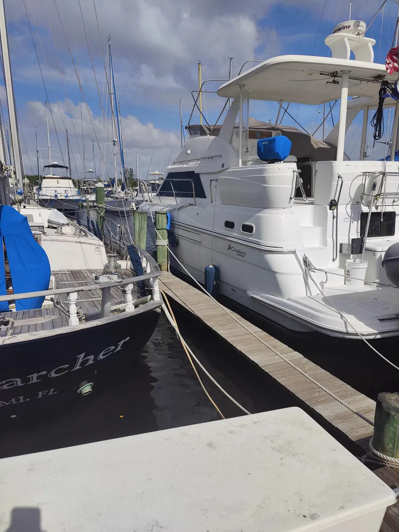 Slide: The Image of 2001 Cruisers Yachts 3750 Motoryacht docked at marina. - 3