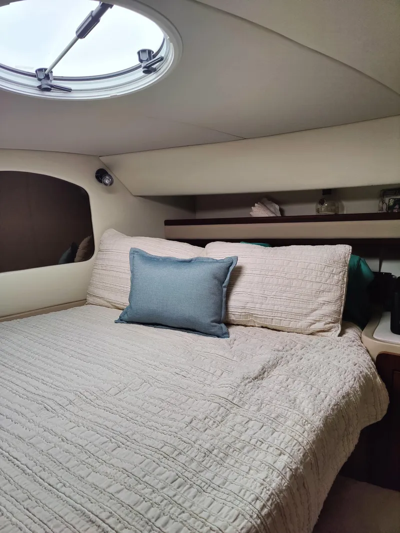 Slide: The Image of 2001 Cruisers Yachts 3750 Motoryacht helm with seating, docked at marina. - 4