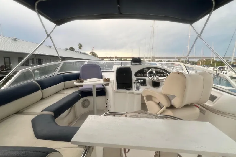 Slide: The Image of 2001 Cruisers Yachts 3750 Motoryacht helm with seating and marina view. - 41