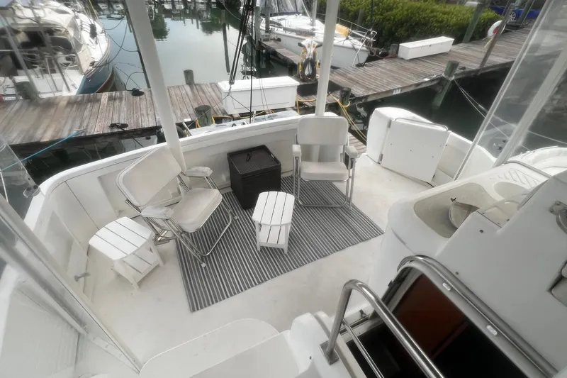Slide: The Image of 2001 Cruisers Yachts 3750 Motoryacht deck with seating area and marina view. - 42
