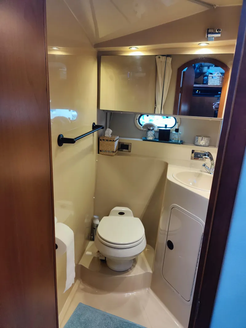 Slide: The Image of Interior of 2001 Cruisers Yachts 3750 Motoryacht, cozy bedroom with bed. - 6